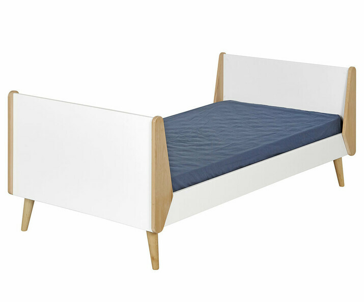 Una cama con diseño escandinavo